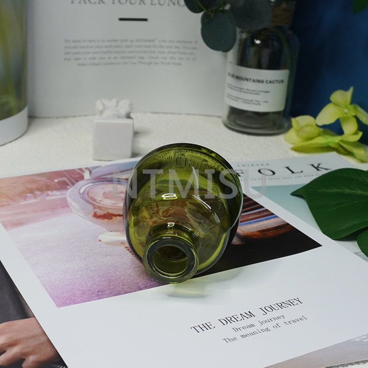 زجاجة عطر عطرية من الزجاج الأخضر سعة 100 مل لتزيين المنزل